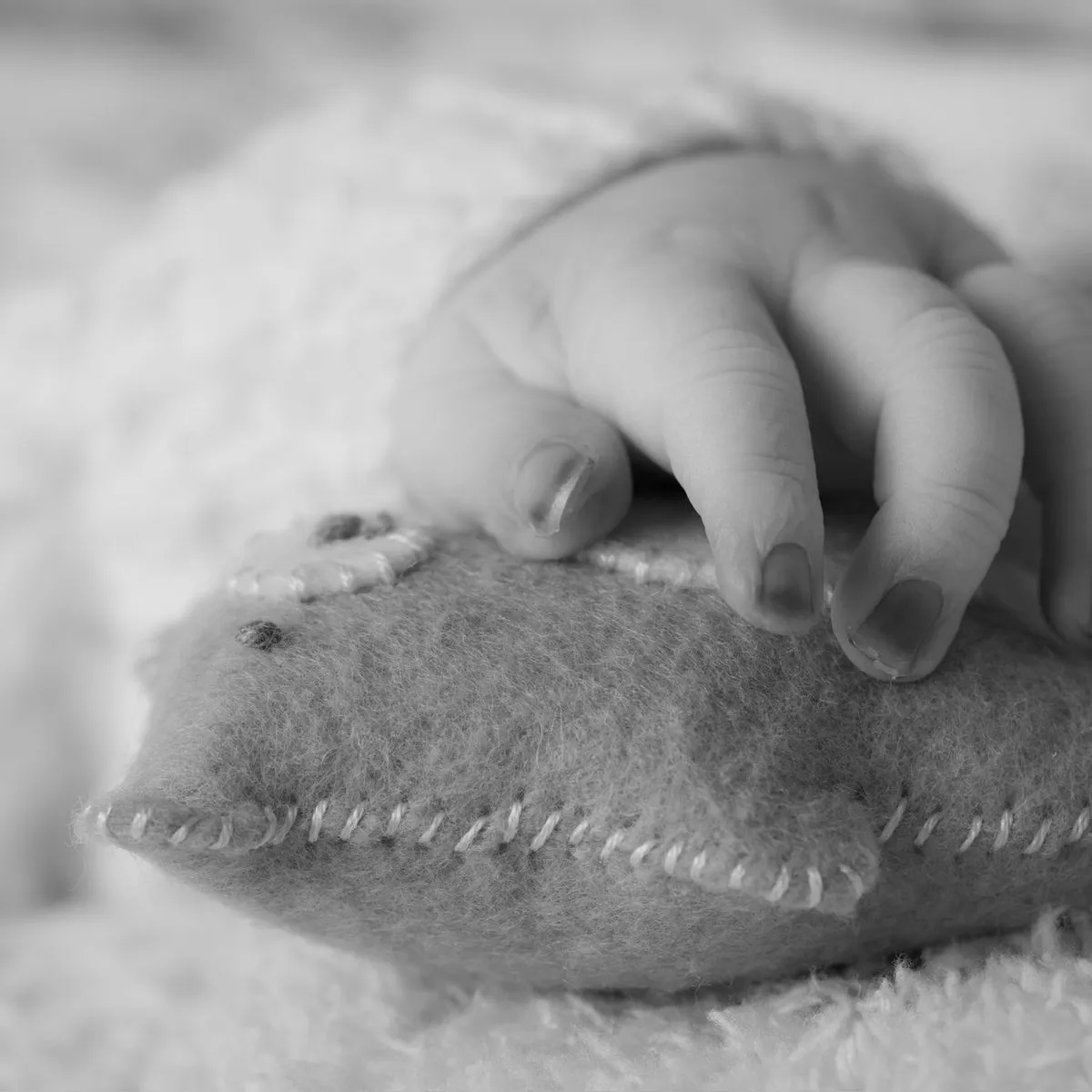 Parker’s little hand, resting on a felt heart.